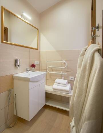 Фото номера Четырехместный номер с ванной комнатой Курортные отели Trakaitis Holiday Home г. Тракай 7