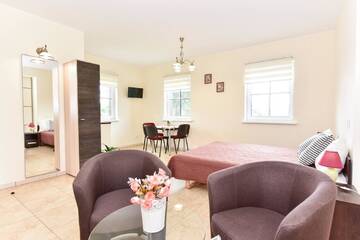 Фото номера Четырехместный номер с ванной комнатой Курортные отели Trakaitis Holiday Home г. Тракай 9