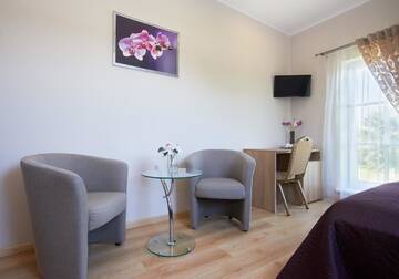 Фото номера Четырехместный номер с ванной комнатой Курортные отели Trakaitis Holiday Home г. Тракай 4