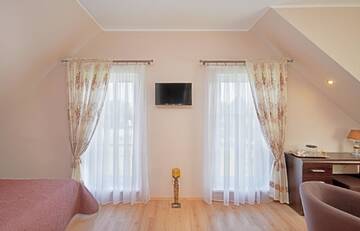 Фото номера Четырехместный номер с ванной комнатой Курортные отели Trakaitis Holiday Home г. Тракай 18
