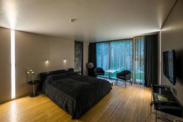 Фото номера Двухместный номер с 2 отдельными кроватями и террасой Отель TonyResort г. Тракай 4